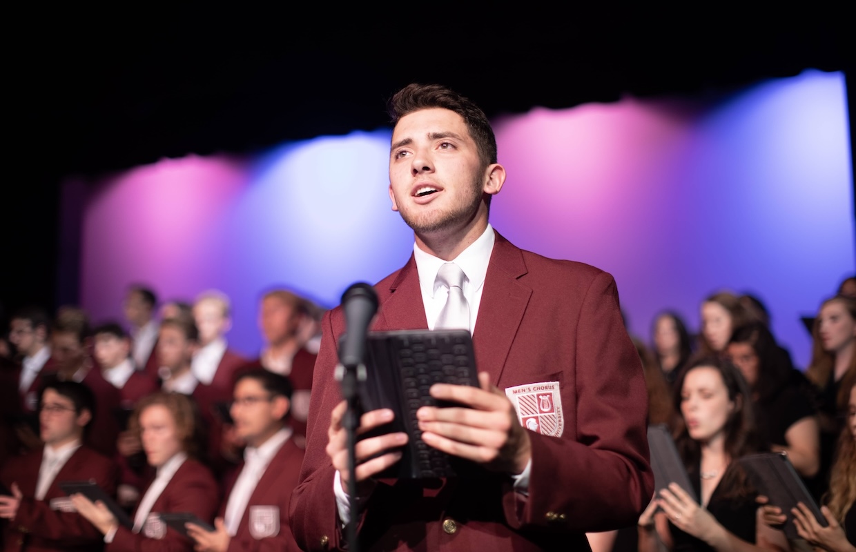 Student singing in choir