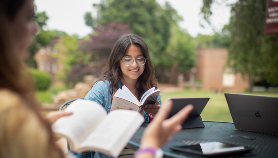 Students reading outside the Kimball Center