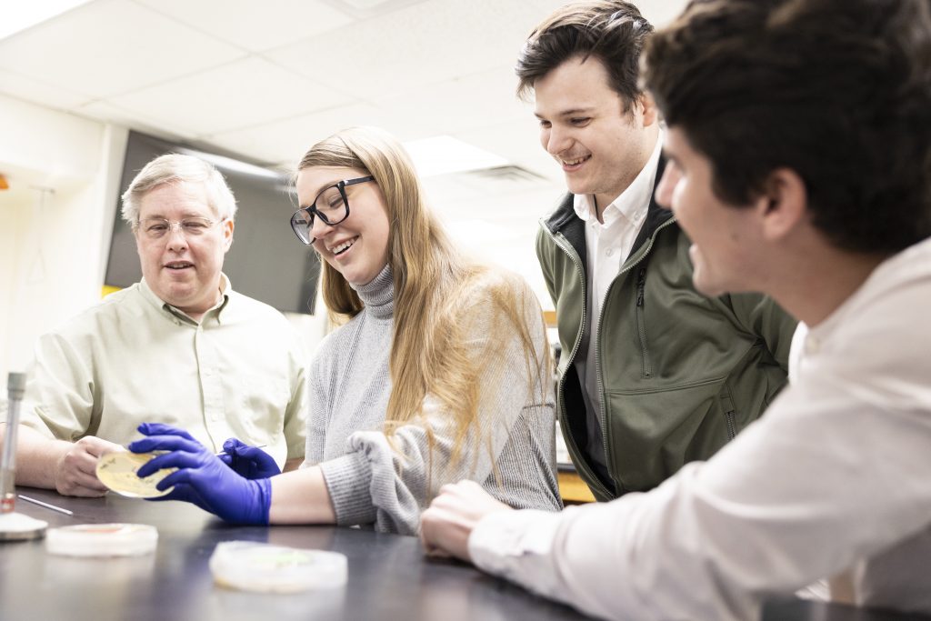 Professor of Biology Dr. Richard Gardner with Janna Tidwell, Clayton Tacker, and Jaden Nelson in the lab